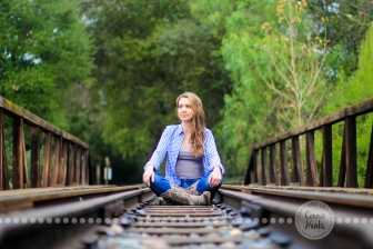 Connie Hanks Photography // ClickyChickCreates.com // sitting outdoors on train track in rustic park!