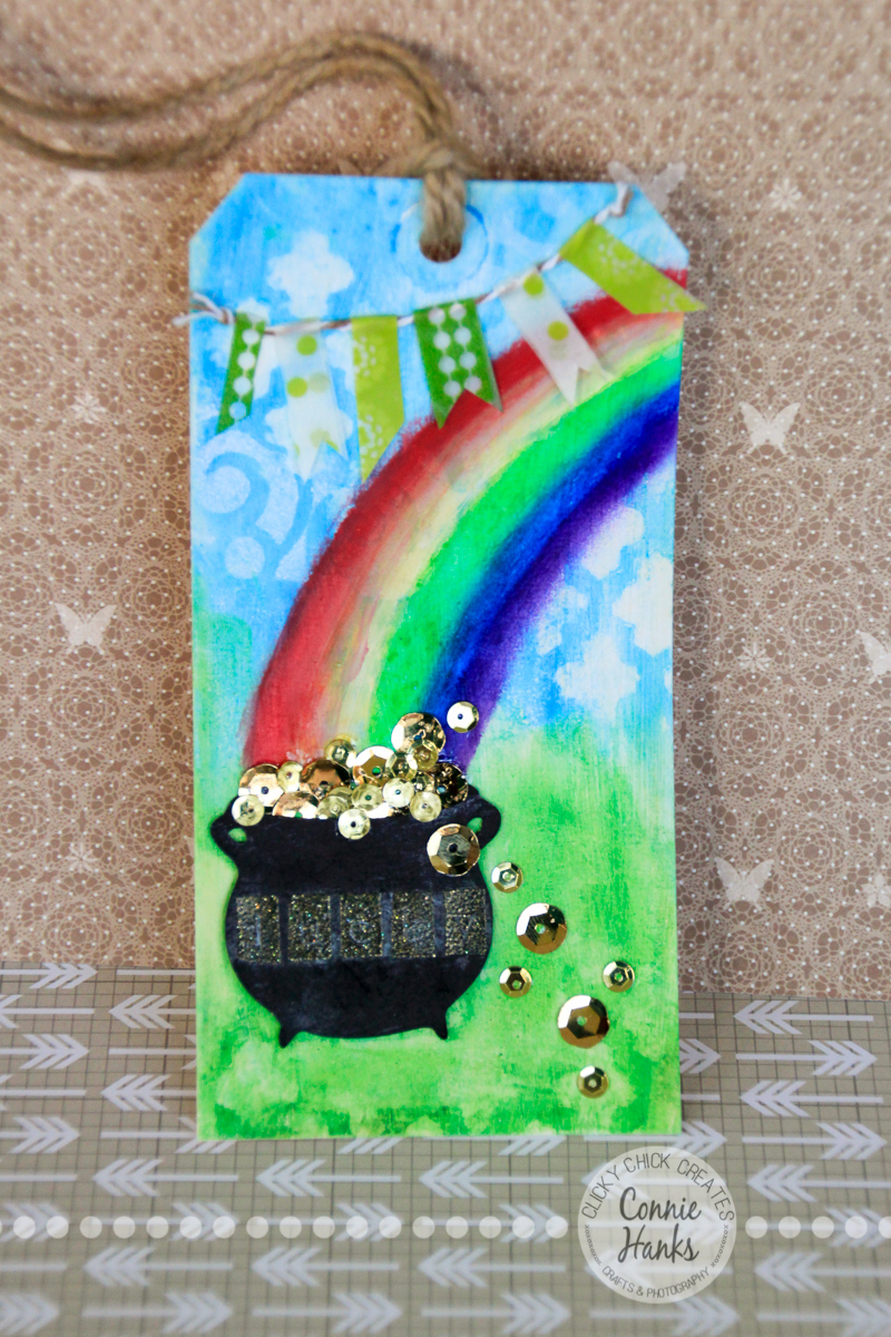 Connie Hanks Photography // ClickyChickCreates.com // St. Patrick's rainbow and pot of gold tag made using Gelatos, Distress Inks, stencils, paint, washi tape, sequins