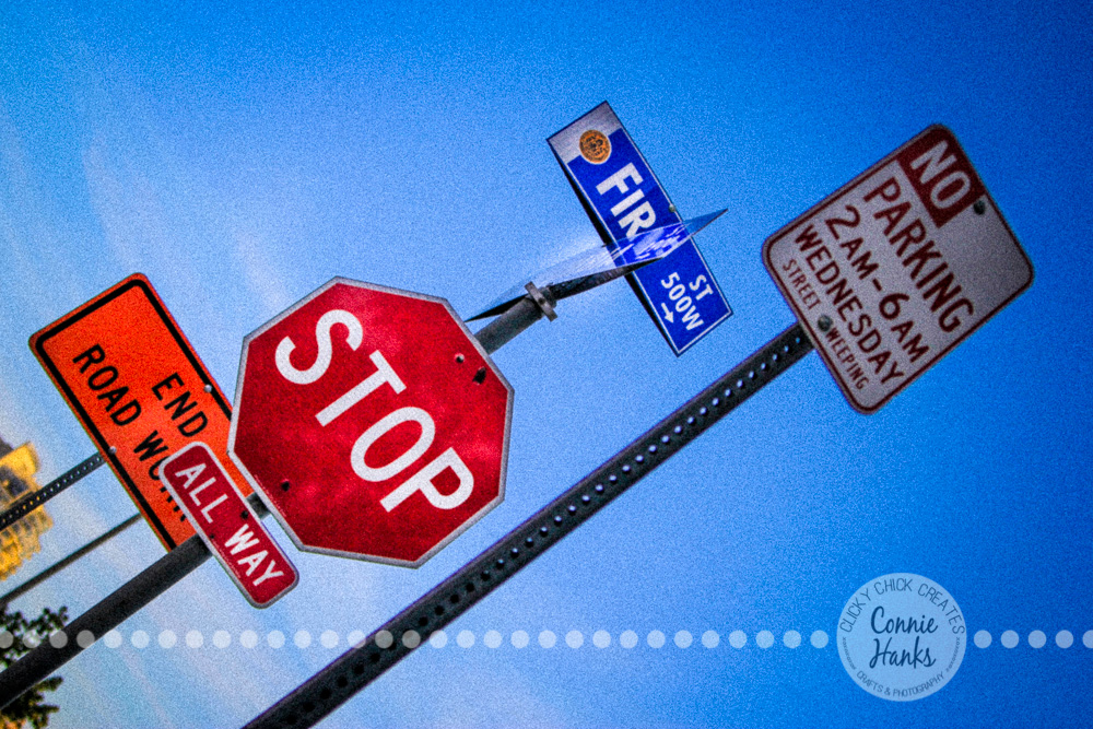 Connie Hanks Photography // ClickyChickCreates.com // street signs, red, stop, blue sky, Little Italy